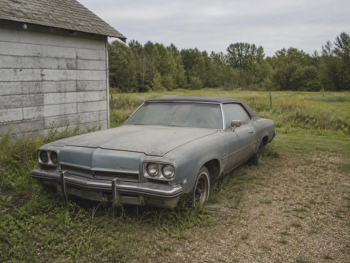 A car without plates sitting unused on an acreage property.