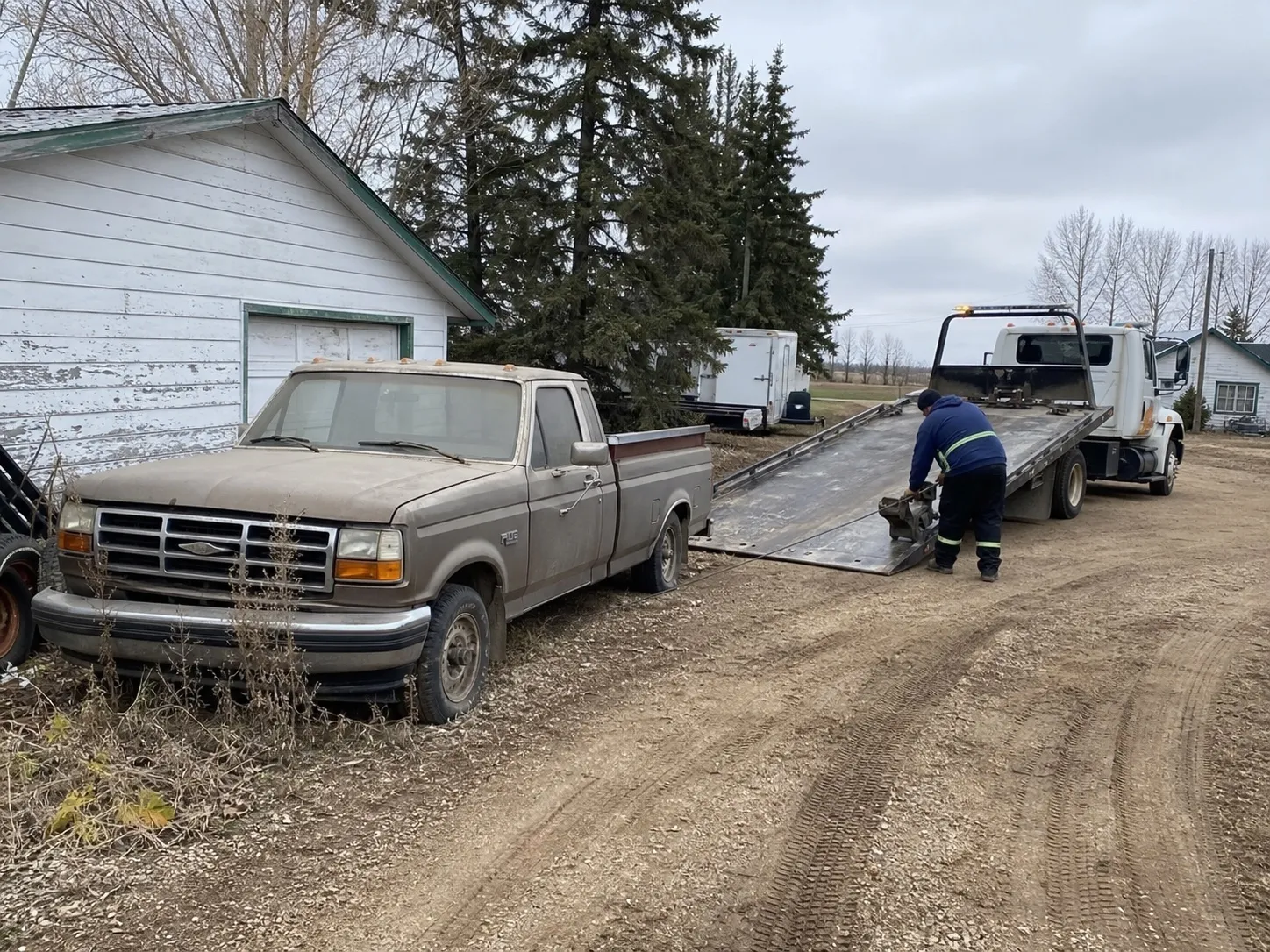 Vehicle collection from a Strathcona County acreage property near Sherwood Park.