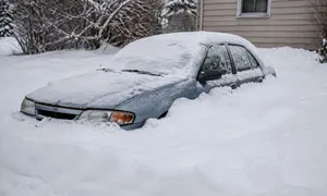 A vehicle buried in snow, still accepted.